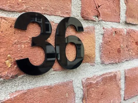Close up of an house door number 36 Stock Photos