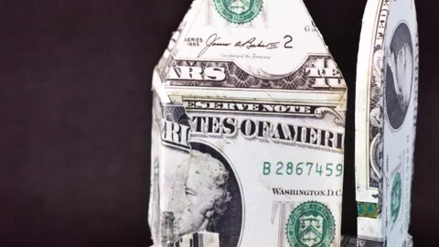 Close-up house model made with dollar banknote rotating Video stock 248387482