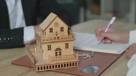 Close Up Of A House Model On The Table During The Signing Of House Purchase 動画素材 200822838