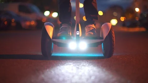 Close-up of a hoverboard that leaves into the distance in the evening Stock Footage 115968169
