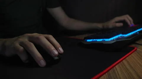 Close up, how Gamer Plays Computer FPS Shooter Video Game  on His Personal Co Stock Footage 151347931