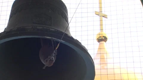 Close-up of huge bell. Othodox cross on white sky background. Sound Stock Footage 94921398