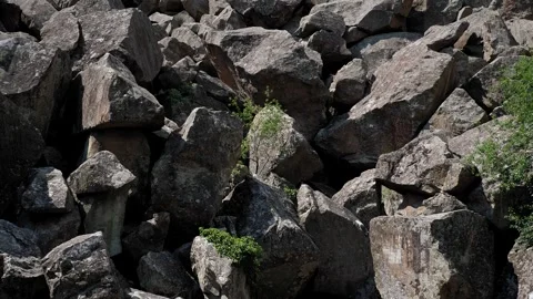 Close-up of a huge mountain of large stones. Quarry, the rocks lie in a big pile Stock Footage 333246489