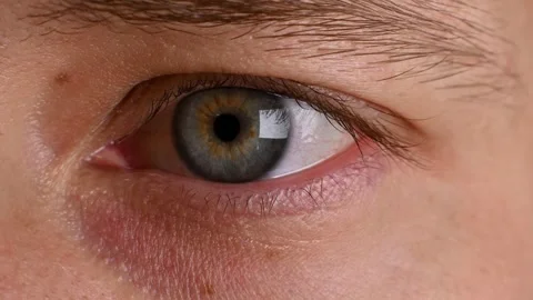 Close-up of human eye with unique iris pattern, showcasing gradual eye movement Stock Footage 330488197
