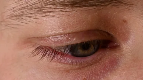 Close-up of human eye with unique iris pattern, showcasing gradual eye movement Stock Footage 330488237