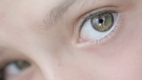 Close up human eyes of 7 years old little girl looking into camera Stock Footage 93636314