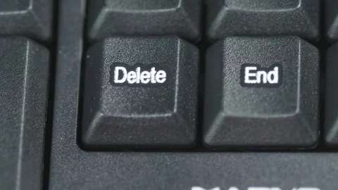 Close up of human finger pushing an delete button on the computer keyboard Stock Footage 75331236