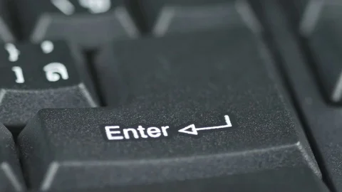 Close up of human finger pushing an Enter button on the computer keyboard Video stock 75330286