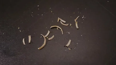 Close Up of Human Fingernail Clippings on Dark Surface – Hygiene Concept Footage Stock Footage 317066037