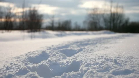 Close-up Human Footprints Trail on Deep Snow. Path in Snowy Field Plains Cold 4K Video stock 149625211