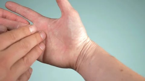 Close up. human hand and psychic or fortune, teller explain lines on palm Stock Footage 95641975