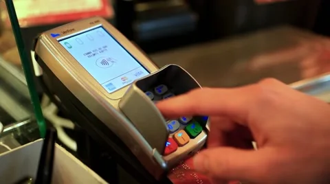 Close-up of human hand holding plastic card in payment machine. HD. 1920x1080 Stock Footage 47469505