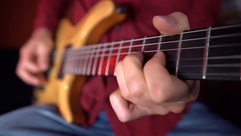 Close up of human hand is playing guitar Vídeo Stock 121359894