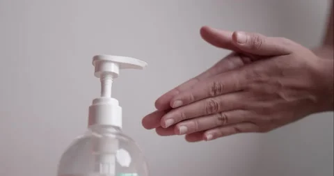 Close up human hand press on pump bottle for using wash hands sanitizer  Stock Footage 200095828