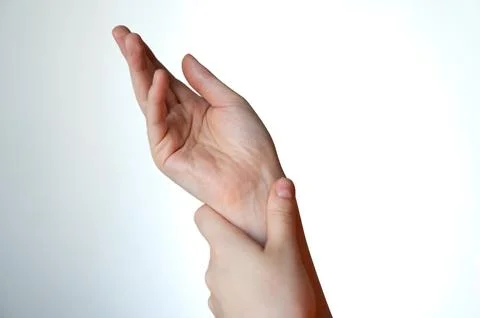 Close-up of human hand reaching forward against white background Stock Photos