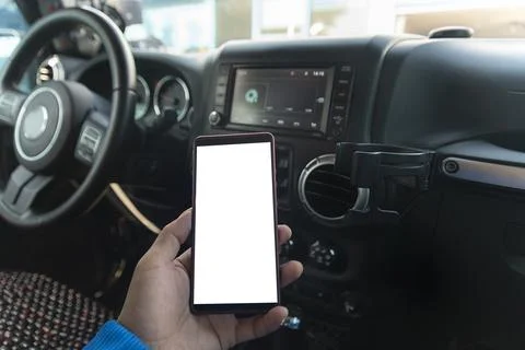 Close up of human hand using smartphone in a car Stock Photos