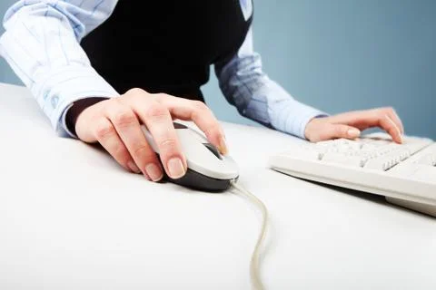 Close-up of human hand on white mouse during computer work Stock Photos