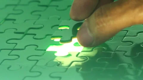 Close Up Human Hands Assembling Jigsaw Puzzle. Leisure Activity. Playing Calm Stock Footage 336248346