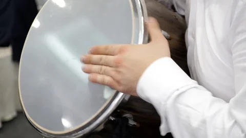 Close-Up of a human hands. A drummer. The man plays the drum with his hands Stock-Footage 126922184