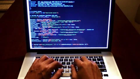Close-up of human hands typing on laptop keyboard at home Man programmer writes Stock-Footage 334586053