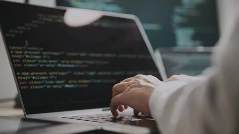 Close-up of human hands typing on laptop keyboard at home Man programmer writes Vídeos de archivo 334586630