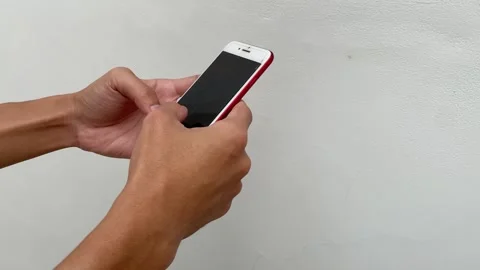 Close up of human hands typing text message and scrolling on smartphone screen Vídeo Stock 330514753