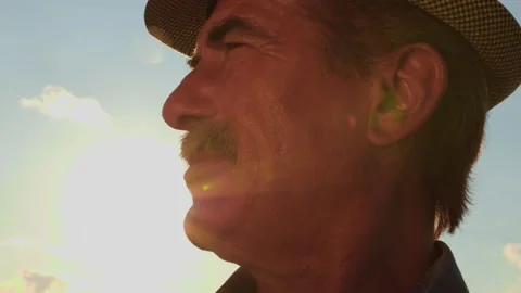 Close up of a human head aged farmer with mustache against in the sky background Stock-Footage 199423332