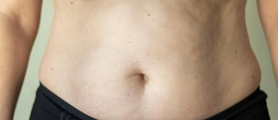 Close-up of a human midsection emphasizing natural skin and texture Stock Photos