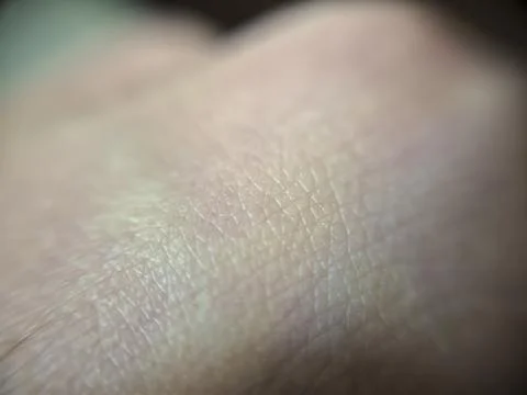 Close-up of human skin texture highlighting details and patterns. Ideal for Stock Photos