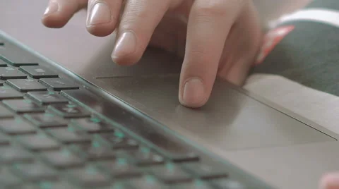 Close-up of a human's hand typing and touching a laptop keyboard Vidéo 68852401