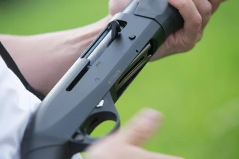 Close up of a hunter loading his weapon Stock Photos
