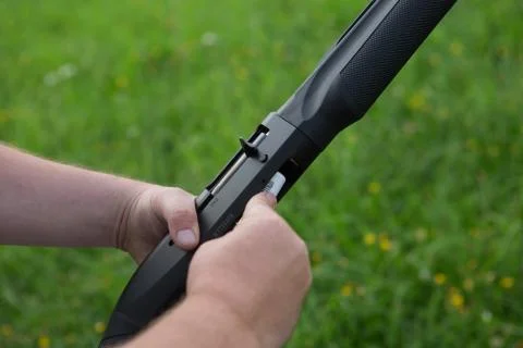 Close up of a hunter loading his weapon Stock Photos