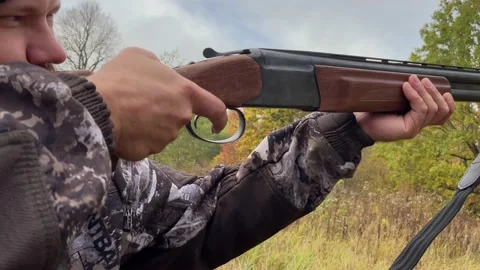 Close-up of a hunter , who is loading cartridges Stock Footage 218758767