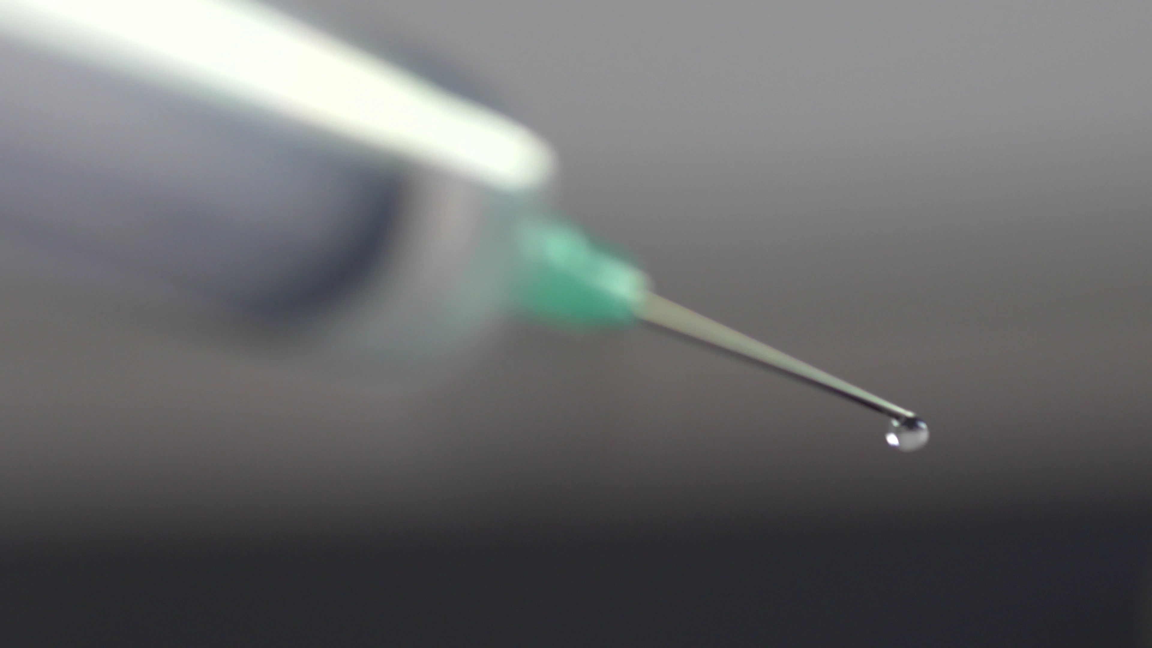 Close up of hypodermic needle dripping