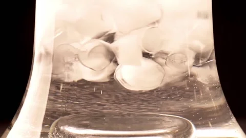 Close up on ice and berries flowing in water. Refreshing summer cool drink with Video stock 150061857