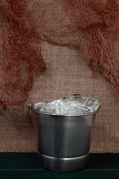 Close-up of ice bucket on rustic background (1) Stock Photos