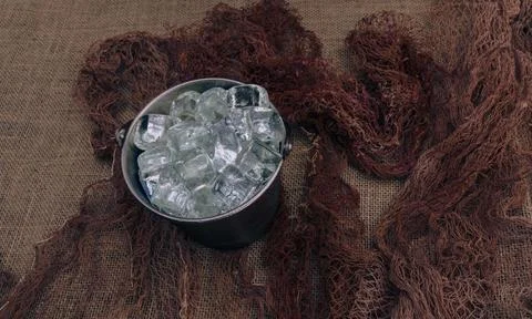 Close-up of ice bucket on rustic background (3) Stock Photos
