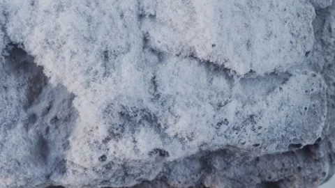 Close up of ice cold snow crystals melting in the sun, macro shot of ice crystal Stock Footage 252364443