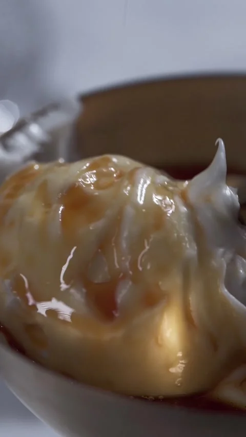 Close-up of Ice Cream with Caramel Drizzle Stock Footage 336327235