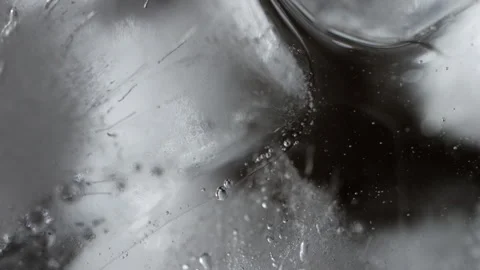 Close-up of ice cube submerged in water a mesmerizing fusion of elements. Stock Footage 253838574