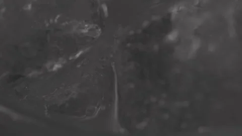 Close up of Ice cubes in drink, rotating glas Stock Footage 242157126