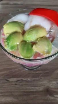 Close up of ice with fruit and coconut on a glass Stock Photos