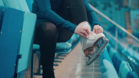 Close up of an ice skating shoe getting laced up Stock Footage 162056222