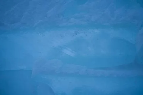 Close-up ice structure. Background in dark blue colors. Winter season, frost  Stock Photos
