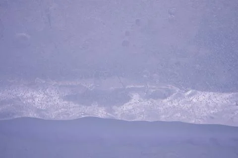 Close-up ice structure. Background in dark blue colors. Winter season, frost  Stock Photos