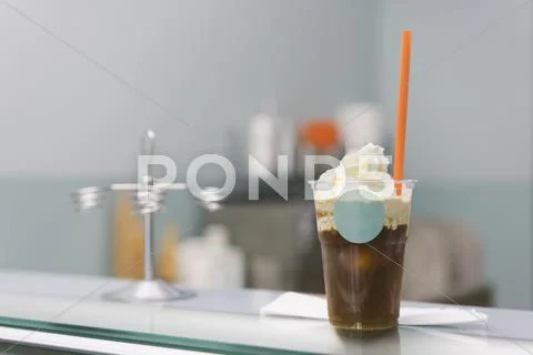 Close-Up Of Iced Coffee On Counter At Store