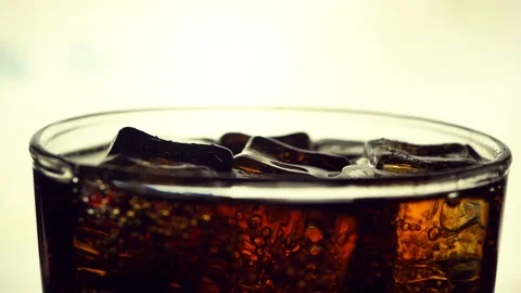 Close up iced cube and cola  Video stock 107399213