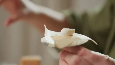 Close Up of Icing Placement on Cake Equipment with Swirl Candy by Caterer Stock-Footage 307125757