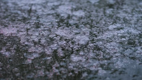 Close-up of icy texture under ambulance light. Zoom out Stock Footage 328627090
