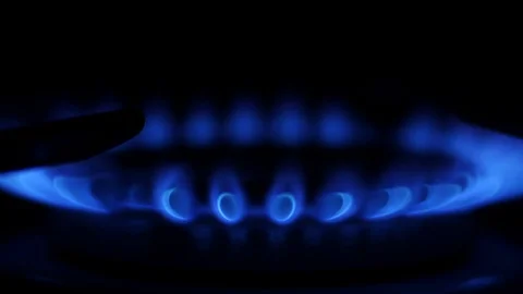 Close up ignition of flame on the kitchen stove. Slow motion Stock Footage 116623164